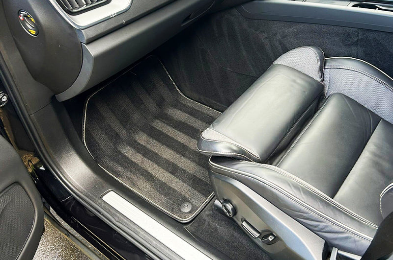Car interior with gray floor mat and seat